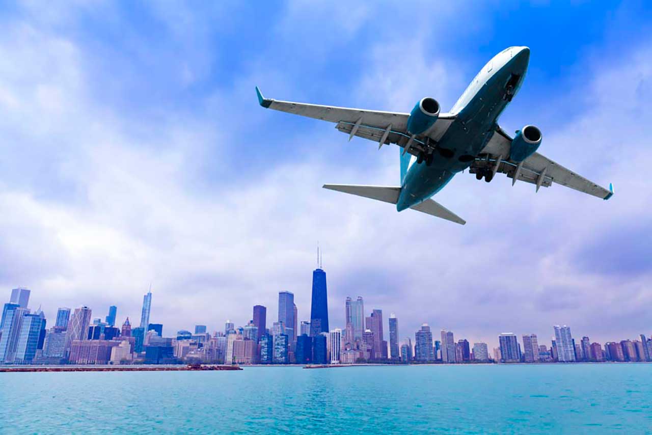 Фотообои в интерьере самолет над городом  9-202 фото