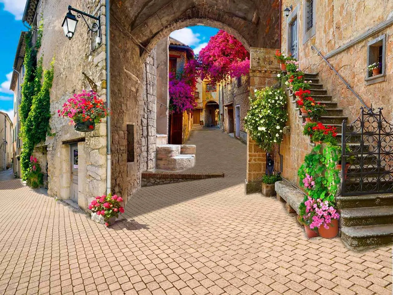 Фотообои в интерьере вид на цветущую улочку города  7-034 фото